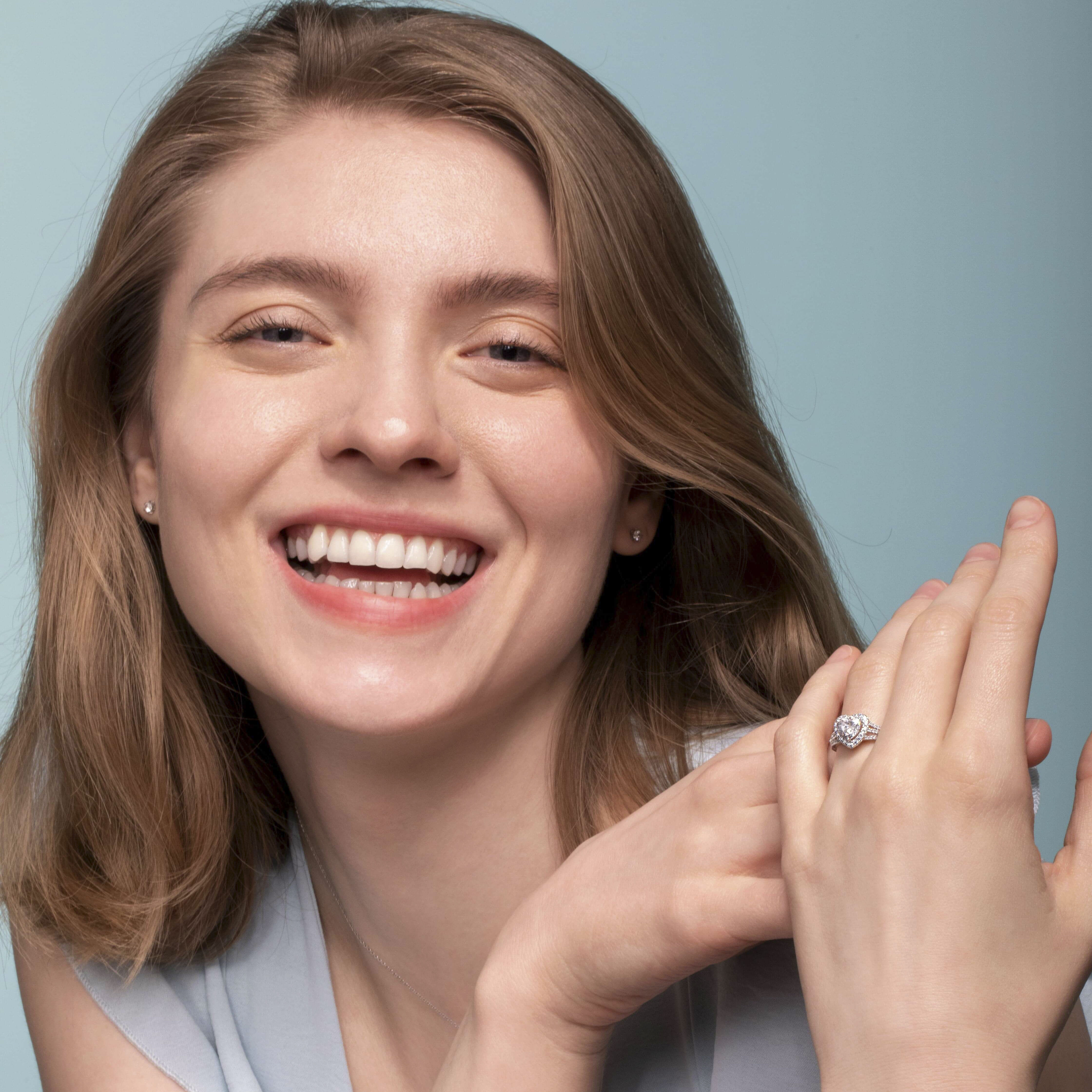 Darry Ring heart promise ring on left ring finger